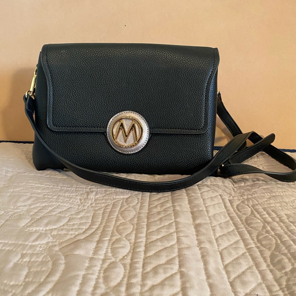 Elegant Black Crossbody Bag with Gold Medallion Accent